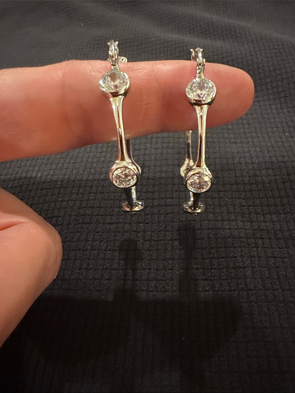 Silver and crystal hoop earrings.
